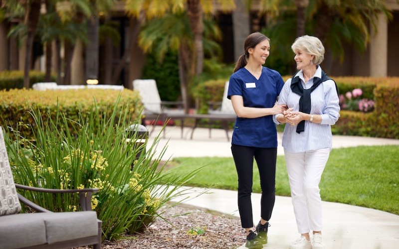 Caregiver and resident walking